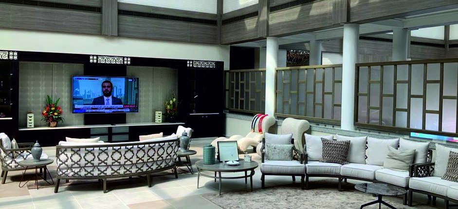 Double-height atrium lounge with screened balcony