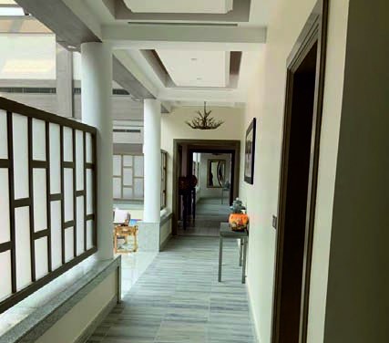 Gallery corridor with geometric lattice balustrade
