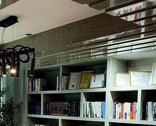 Library joinery with a sculptural pendant light