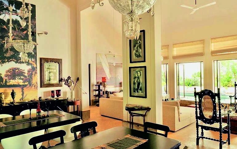 Villa dining area with antique chairs and crystal chandeliers